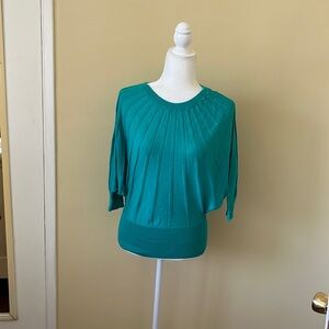 Teal 3/4 sleeve knit top. Size small.  In great condition